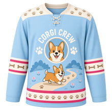 Load image into Gallery viewer, Happy Corgi Trails Original Hockey Jersey in Sky Blue, front view – smiling corgi trotting on a path with paw prints and corgi crest, custom name and number