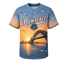 Load image into Gallery viewer, Harbor Bridge Sunrise Milwaukee Baseball Jersey in Steel Blue, front view – steel arch bridge, freighters and gulls at sunrise, custom name and number