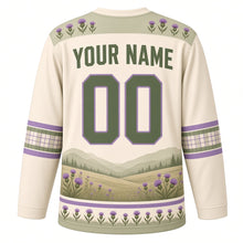 Load image into Gallery viewer, Highland Cow Meadow Original Hockey Jersey in Oat Cream, back view with your name and number – thistle-pattern yoke and plaid-check sleeve bands