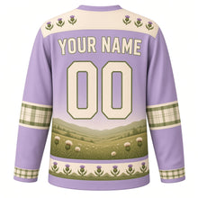 Load image into Gallery viewer, Highland Cow Meadow Original Hockey Jersey in Heather Lilac, back view with your name and number – thistle-pattern yoke and plaid-check sleeve bands