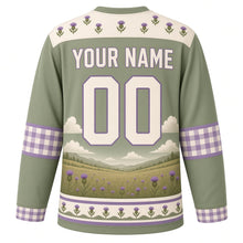 Load image into Gallery viewer, Highland Cow Meadow Original Hockey Jersey in Meadow Sage, back view with your name and number – thistle-pattern yoke and plaid-check sleeve bands