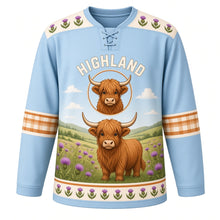 Load image into Gallery viewer, Highland Cow Meadow Original Hockey Jersey in Thistle Sky, front view – shaggy ginger highland cow in a thistle meadow with highland cow crest, custom name and number