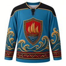 Load image into Gallery viewer, Hiri Moale Festival Original Hockey Jersey in Coral Sea Blue, front view with themed artwork and clean crest