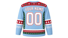 Load image into Gallery viewer, Ugly Christmas Polar Bear Hockey Jersey in Ice Blue, back view of the hockey jersey with a snowflake and pine tree patterned yoke and matching sleeve and hem stripe bands, YOUR NAME arc and 00 number, custom name and number