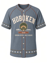 Load image into Gallery viewer, Hoboken Heritage Baseball Jersey in Blue Gray, front view – blue gray body with cream and terracotta piping, ballfield emblem with Hudson River skyline and rope-and-star trim, 1846 – custom name and number