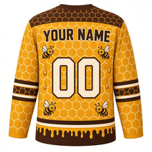 Load image into Gallery viewer, Honeycomb Bees Original Hockey Jersey in Honey Amber, back view with your name and number – hexagon yoke and honey-drip hem stripes