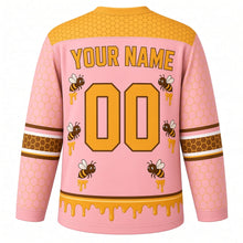 Load image into Gallery viewer, Honeycomb Bees Original Hockey Jersey in Blush Blossom, back view with your name and number – hexagon yoke and honey-drip hem stripes