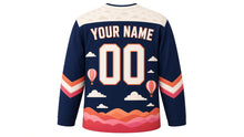 Load image into Gallery viewer, Hot Air Balloon Skies Original Hockey Jersey in Twilight Navy, back view with your name and number – cloud-pattern yoke and balloon-stripe chevron sleeve bands