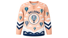 Load image into Gallery viewer, Hot Air Balloon Skies Original Hockey Jersey in Sunrise Peach, front view – colorful striped hot air balloons floating through a bright sky with balloon crest, custom name and number