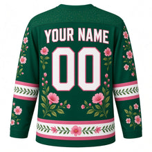 Load image into Gallery viewer, Hummingbird Garden Original Hockey Jersey in Emerald Garden, back view with your name and number – leaf-pattern yoke and flower-and-leaf hem stripes