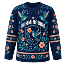 Load image into Gallery viewer, Hummingbird Garden Original Hockey Jersey in Twilight Indigo, front view – two hovering hummingbirds, trumpet flowers and single-hummingbird oval crest, custom name and number