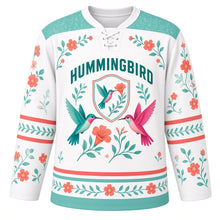 Load image into Gallery viewer, Hummingbird Garden Original Hockey Jersey in Blossom White, front view – two hovering hummingbirds, trumpet flowers and single-hummingbird oval crest, custom name and number