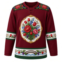 Load image into Gallery viewer, Hungary Original Hockey Jersey in Danube Burgundy, front view – hand-painted porcelain-style crest of a Matyó and Kalocsa flower bouquet with paprika, ornate Matyó embroidery yoke, detailed artwork, custom name and number