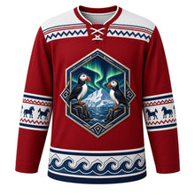 Load image into Gallery viewer, Iceland Original Hockey Jersey in Lava Red, front view – basalt-column crest of puffins under the aurora, ornate lopapeysa knit-pattern yoke, detailed artwork, custom name and number