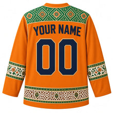 Load image into Gallery viewer, India Original Hockey Jersey in Monsoon Saffron, back view – Bandhani-dot and block-print floral yoke and ornate sleeve bands, with your name and number