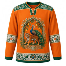 Load image into Gallery viewer, India Original Hockey Jersey in Monsoon Saffron, front view – ornate tiger-and-peacock Mughal-arch crest with mango branches and Bandhani-dot and block-print floral yoke, detailed artwork, custom name and number