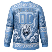 Load image into Gallery viewer, Jungle Tiger Roar Original Hockey Jersey in Snow Tiger Blue, back view with your name and number – tiger-stripe yoke and palm-leaf sleeve stripes
