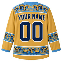 Load image into Gallery viewer, Kazakhstan Original Hockey Jersey in Golden Eagle Gold, back view – ornate ram's-horn felt-mosaic yoke with tulip and horn-scroll sleeve bands, with your name and number