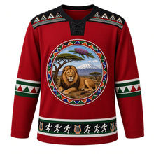 Load image into Gallery viewer, Kenya Original Hockey Jersey in Maasai Red, front view – ornate Maasai beadwork collar crest with lion, acacia, Mount Kenya and lilac-breasted roller, kikoy stripe yoke, detailed illustrated artwork, custom name and number