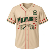 Load image into Gallery viewer, Lake Park Pavilion Milwaukee Baseball Jersey in Bluff Stone Tan, front view – stone footbridge and maple leaf graphic with oak-leaf crest, custom name and number