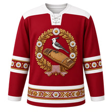 Load image into Gallery viewer, Latvia Original Hockey Jersey in Baltic Carmine, front view – ornate daisy, oak-leaf and white wagtail wreath crest and Lielvārde belt weave yoke with finely detailed artwork, custom name and number