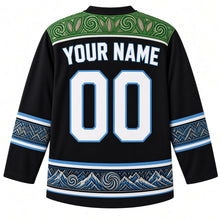 Load image into Gallery viewer, Lesotho Original Hockey Jersey in Basalt Black, back view with your name and number – Basotho blanket-pattern yoke, woven-grass chevron sleeve bands and mountain-and-aloe hem band, ornate detailed artwork