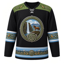 Load image into Gallery viewer, Lesotho Original Hockey Jersey in Basalt Black, front view – Maletsunyane Falls, Mount Qiloane and Basotho pony crest with spiral aloe, Basotho blanket-pattern yoke and woven-grass sleeve bands, ornate detailed artwork, custom name and number