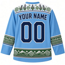 Load image into Gallery viewer, Lesotho Original Hockey Jersey in Maloti Sky Blue, back view with your name and number – Basotho blanket-pattern yoke, woven-grass chevron sleeve bands and mountain-and-aloe hem band, ornate detailed artwork