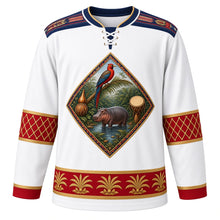 Load image into Gallery viewer, Liberia Original Hockey Jersey in Cotton Country White, front view – pepper bird, oil palm and pygmy hippo crest with saasaa rattle and drum, country-cloth strip-weave yoke and gourd bead-net sleeve bands, ornate detailed artwork, custom name and number