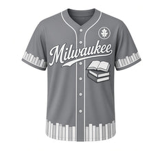Load image into Gallery viewer, Library Reading Milwaukee Baseball Jersey in Stacks Steel Gray, front view – stack of hardcover books with open book graphic and oak-leaf crest, custom name and number