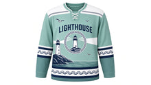 Load image into Gallery viewer, Lighthouse Coast Original Hockey Jersey in Sea Glass, front view – striped lighthouse on a rocky coast with a sweeping beam and lighthouse crest, custom name and number