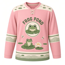 Load image into Gallery viewer, Lily Pad Frog Pond Original Hockey Jersey in Lotus Pink, front view – happy little frog on a lily pad with a water lily and frog crest, custom name and number