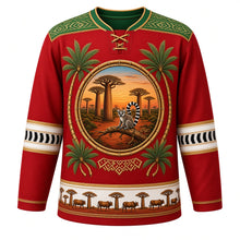 Load image into Gallery viewer, Madagascar Original Hockey Jersey in Baobab Sunset Red, front view – ornate lamba-weave yoke and baobab-and-lemur crest, detailed illustrated artwork, custom name and number