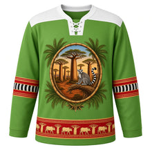 Load image into Gallery viewer, Madagascar Original Hockey Jersey in Ravinala Green, front view – ornate lamba-weave yoke and baobab-and-lemur crest, detailed illustrated artwork, custom name and number