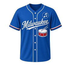 Load image into Gallery viewer, Marching Band Drum Milwaukee Baseball Jersey in Parade Lake Blue, front view – snare drum with crossed drumsticks graphic with music-note crest, custom name and number