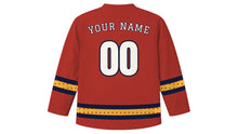 Load image into Gallery viewer, Matariki Original Hockey Jersey in Ochre Red, back view with your name and number