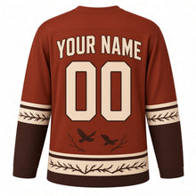 Load image into Gallery viewer, Midnight Crow Original Hockey Jersey in Autumn Rust, back view with your name and number – feather-pattern yoke and bare-branch hem stripes