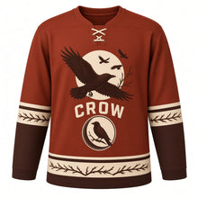 Load image into Gallery viewer, Midnight Crow Original Hockey Jersey in Autumn Rust, front view – crow with spread wings before a full moon with perched-crow crescent crest, custom name and number