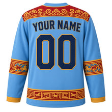 Load image into Gallery viewer, Mongolia Original Hockey Jersey in Steppe Sky Blue, back view with your name and number – khee-ornament yoke and ger lattice sleeve bands