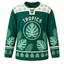 Load image into Gallery viewer, Monstera Leaf Tropics Original Hockey Jersey in Jungle Emerald, front view – large split monstera leaves and palm fronds with monstera crest, custom name and number