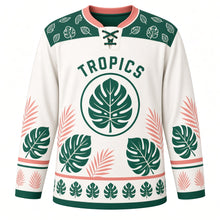 Load image into Gallery viewer, Monstera Leaf Tropics Original Hockey Jersey in Linen White, front view – large split monstera leaves and palm fronds with monstera crest, custom name and number