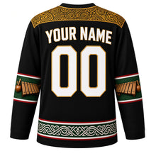 Load image into Gallery viewer, Mozambique Original Hockey Jersey in Ebony Black, back view with your name and number – capulana wax-print yoke and timbila keyboard sleeve bands
