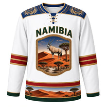 Load image into Gallery viewer, Namibia Original Hockey Jersey in Gemsbok White, front view – Makalani basketry yoke and gemsbok Namib dune crest with ornate detailed artwork, custom name and number