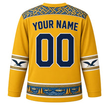 Load image into Gallery viewer, Nauru Original Hockey Jersey in Anibare Gold, back view with your name and number – pandanus-weave yoke and frigatebird sleeve bands