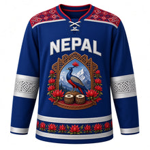 Load image into Gallery viewer, Nepal Original Hockey Jersey in Monal Blue, front view – NEPAL chest lettering, Dhaka-weave yoke and danphe-pheasant carved-window crest in ornate detailed artwork, custom name and number