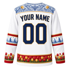 Load image into Gallery viewer, Netherlands Original Hockey Jersey in Porcelain White, back view with your name and number – Hindeloopen-painted yoke and Delft-tile sleeve bands