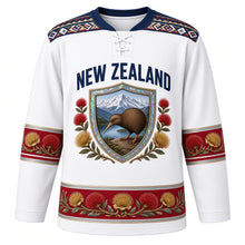 Load image into Gallery viewer, New Zealand Original Hockey Jersey in Alpine Snow White, front view – NEW ZEALAND chest lettering, taniko-style yoke and kiwi-and-pohutukawa shield crest in ornate detailed artwork, custom name and number