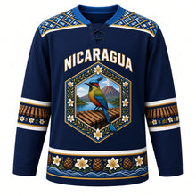 Load image into Gallery viewer, Nicaragua Original Hockey Jersey in Momotombo Navy, front view – NICARAGUA chest lettering, Masaya hammock-weave yoke and guardabarranco volcano medallion crest in ornate detailed artwork, custom name and number