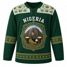 Load image into Gallery viewer, Nigeria Original Hockey Jersey in Delta Forest Green, front view – adire-pattern yoke and diamond crowned-crane Zuma Rock crest in ornate detailed artwork, custom name and number