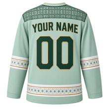 Load image into Gallery viewer, Nigeria Original Hockey Jersey in Palm Mint, back view with your name and number – adire-pattern yoke and aso-oke woven sleeve bands